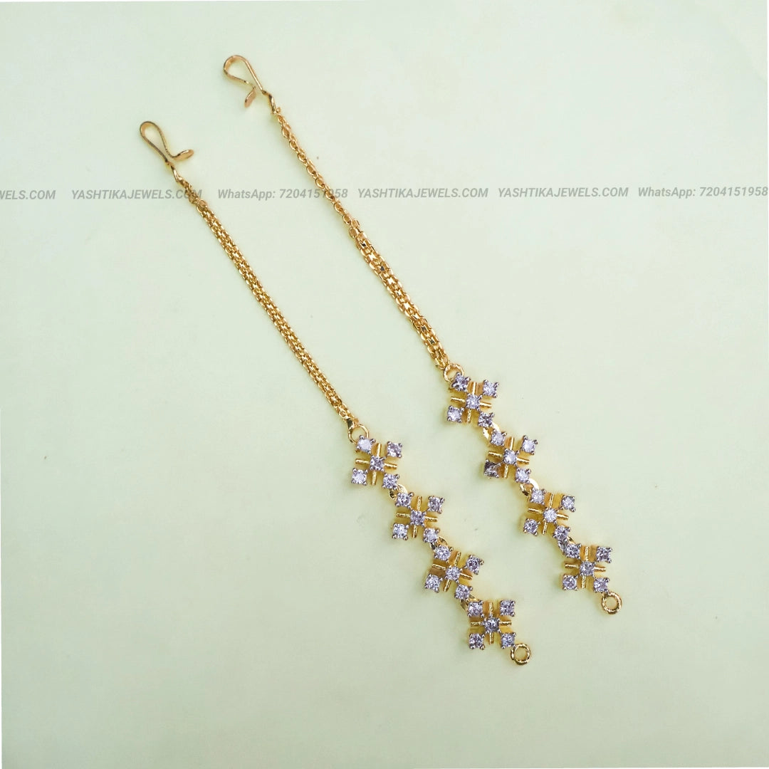 Gold-tone CZ stone ear chain with sparkling white stones in a floral geometric pattern