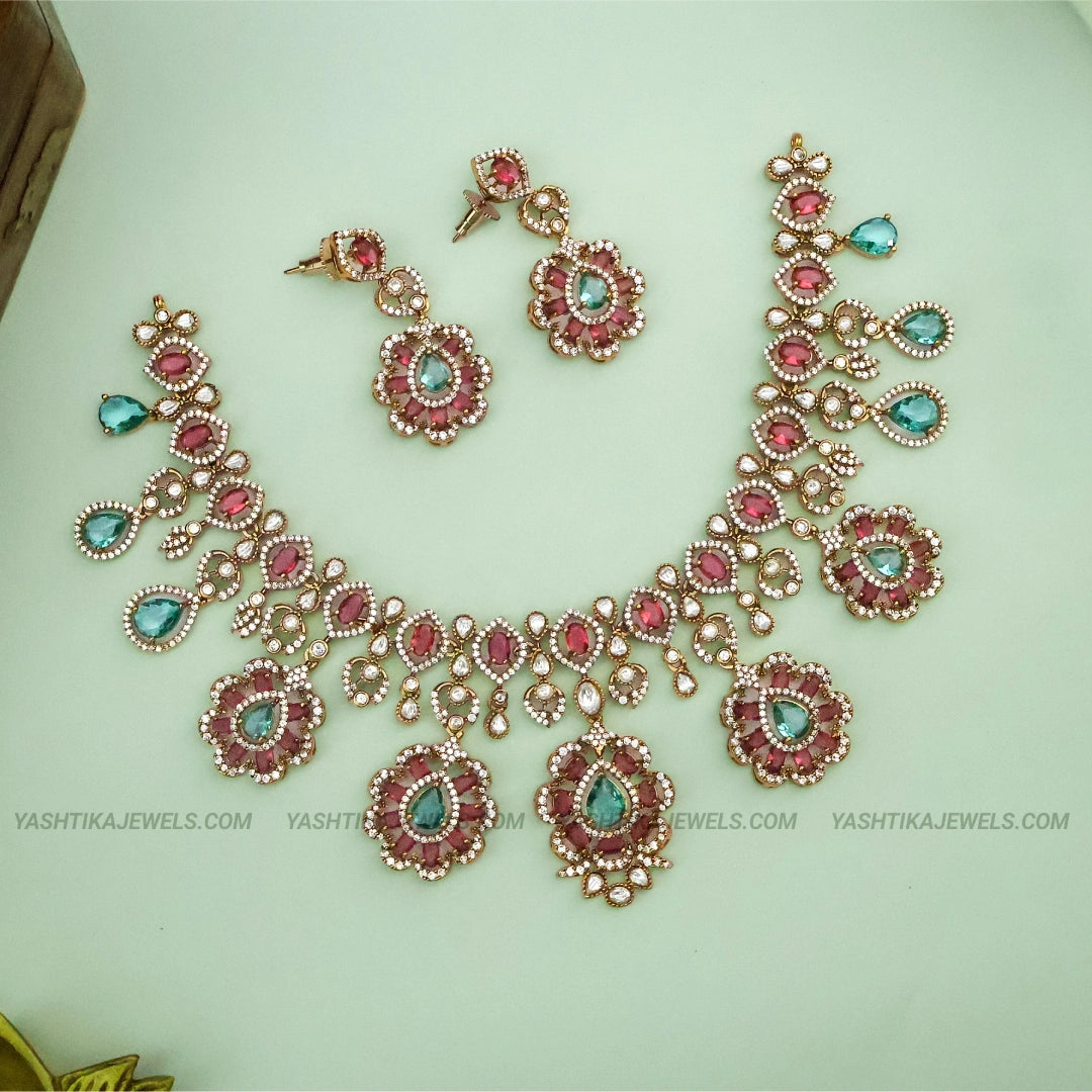 Victorian pastel droplet necklace in antique gold with Moissanite & semi-precious stones
Moissanite and semi-precious stone detail on Victorian droplet necklace
Victorian pastel necklace styled with saree for party wear