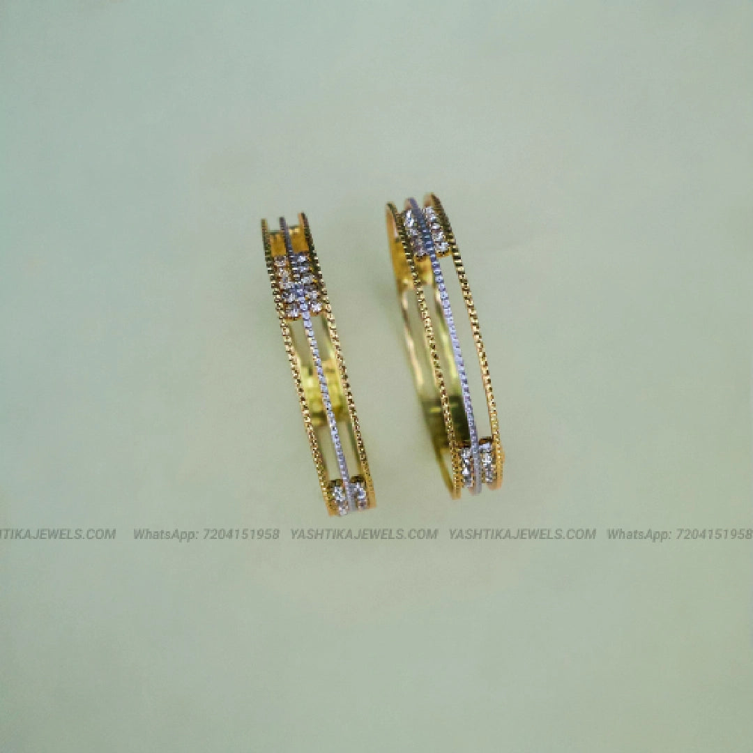 Gold tone kids bangles pair with white stone multi-line design