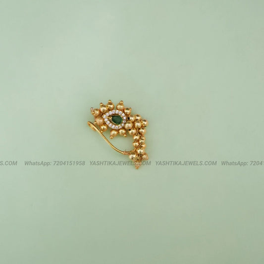 Antique gold nose clip with emerald stone and white stone border - skin friendly