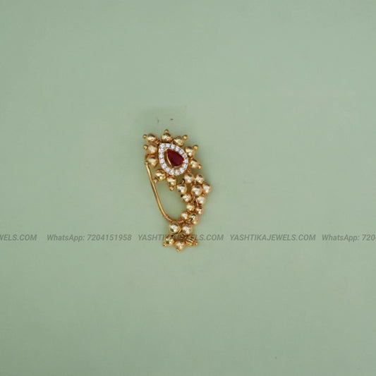 Antique gold nose clip with emerald stone and white stone border - skin friendly