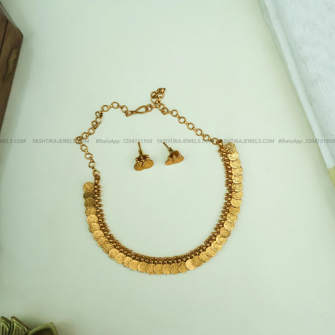 Lakshmi coin long haram in antique gold finish - weightless design
Matching stud earrings for Lakshmi coin long haram set