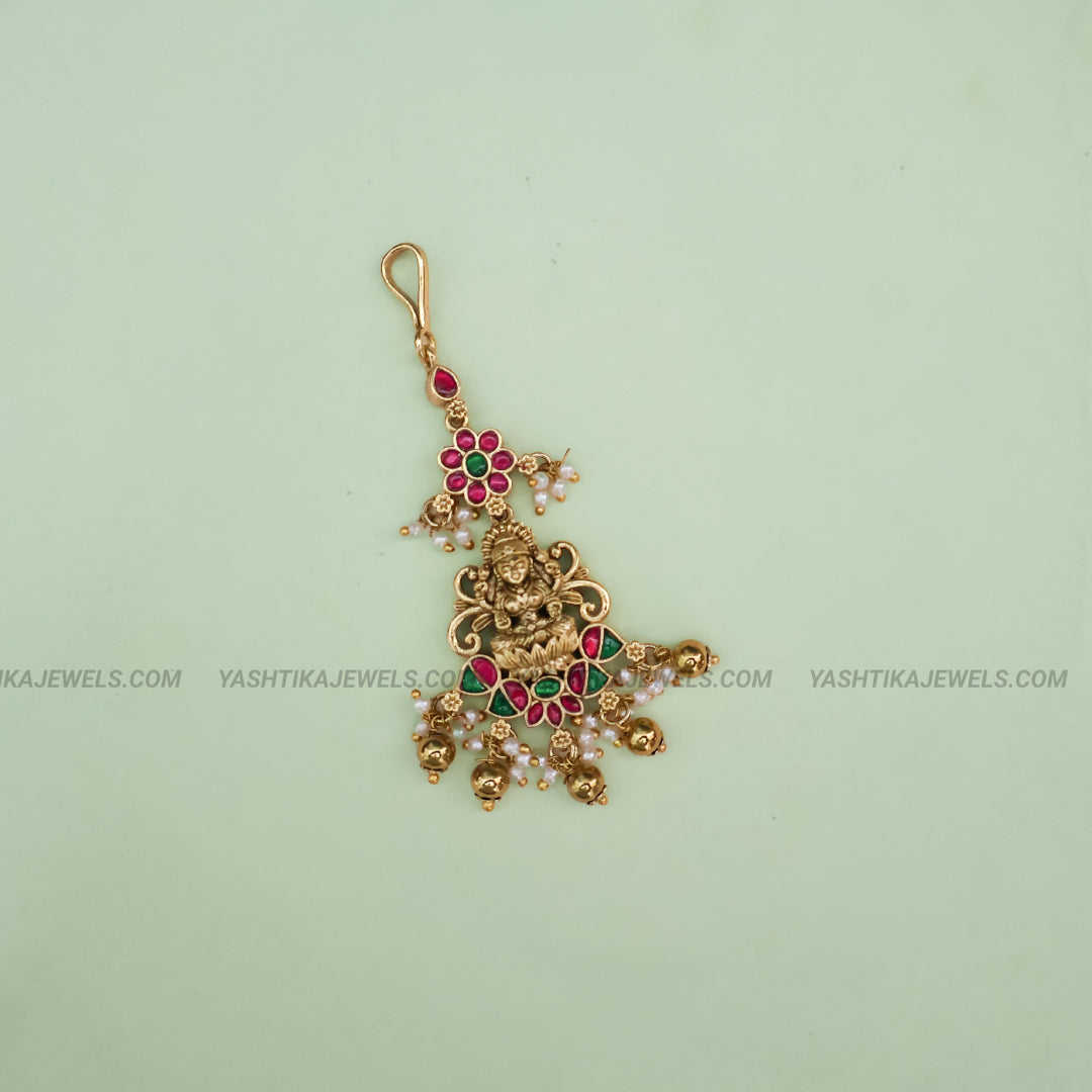 Antique gold brass Lakshmi floral jadau maang tikka with kemp ruby-emerald stones and pearl bead drops - South Indian temple jewelry