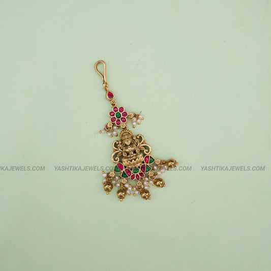 Antique gold brass Lakshmi floral jadau maang tikka with kemp ruby-emerald stones and pearl bead drops - South Indian temple jewelry