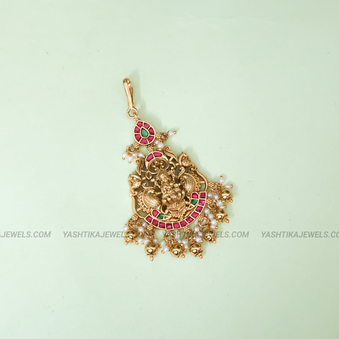 Antique gold Lakshmi jadau maang tikka with kemp ruby and emerald stones and pearl bead drops - South Indian temple jewelry