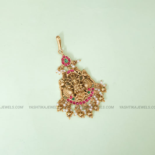 Antique gold Lakshmi jadau maang tikka with kemp ruby and emerald stones and pearl bead drops - South Indian temple jewelry