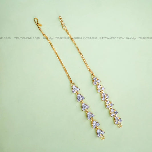 Gold-tone CZ stone ear chain featuring sparkling white stones in a floral cluster design